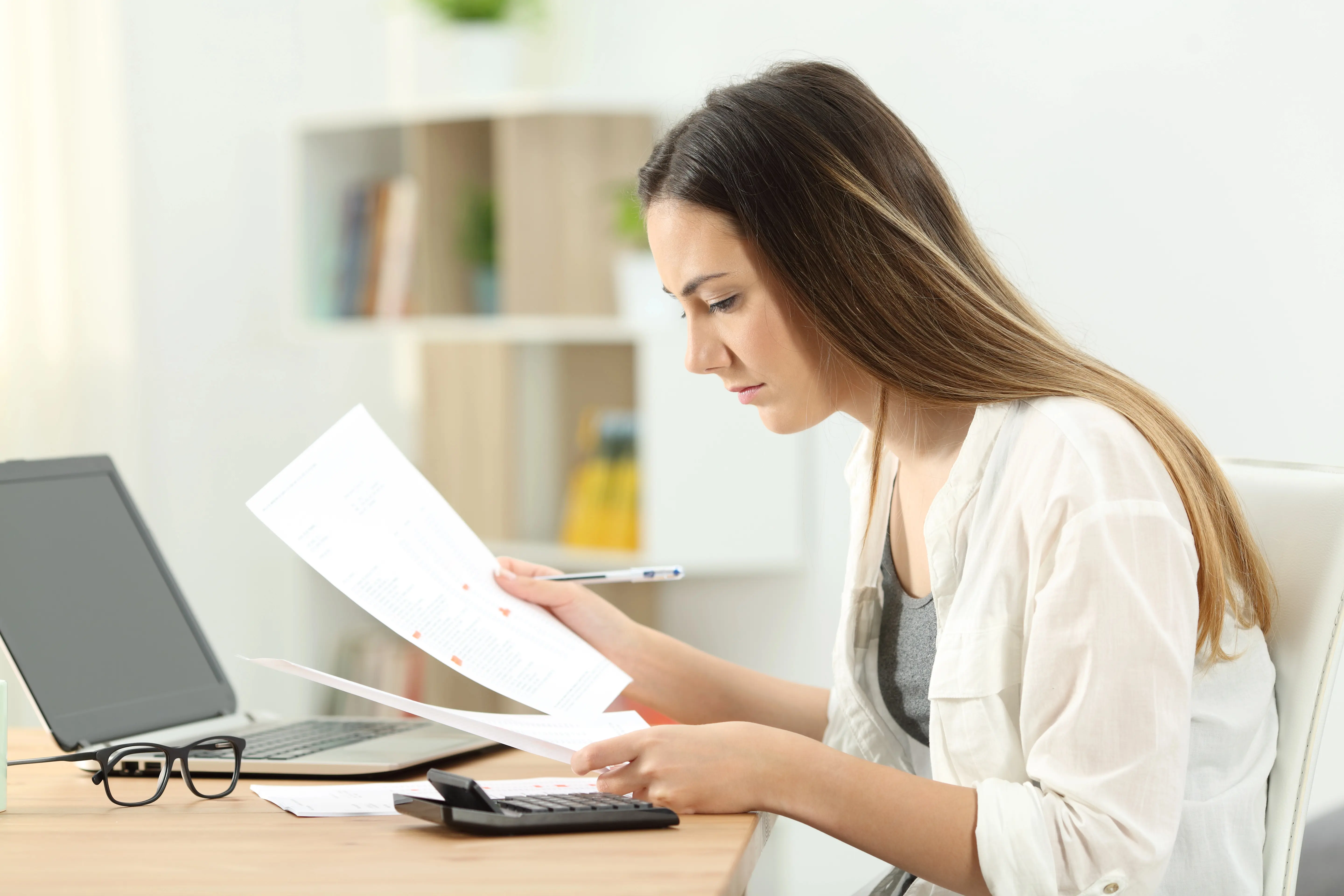 Women looking at documents in confusion
