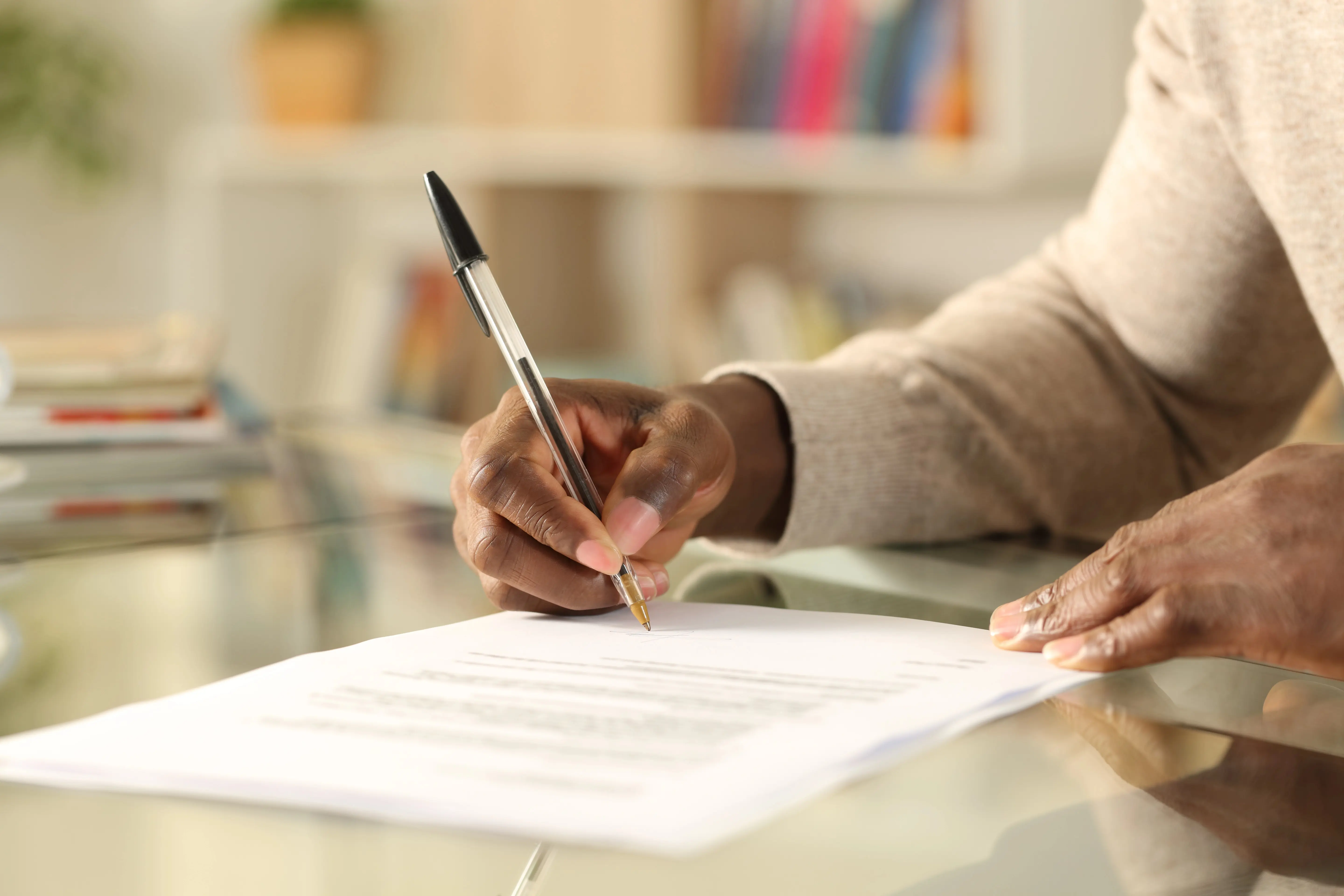 Person filling out documents