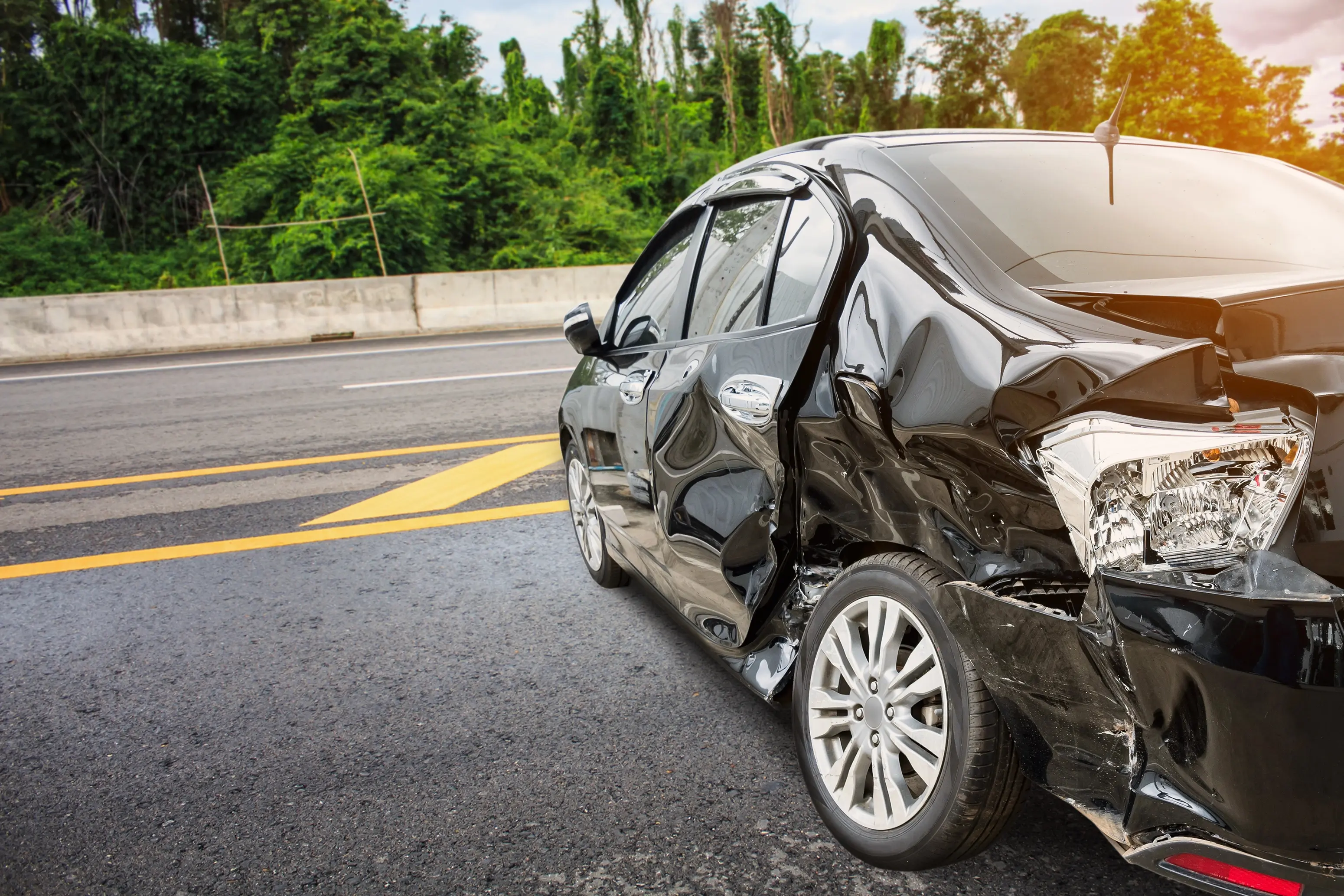 Car damaged on the side of the road