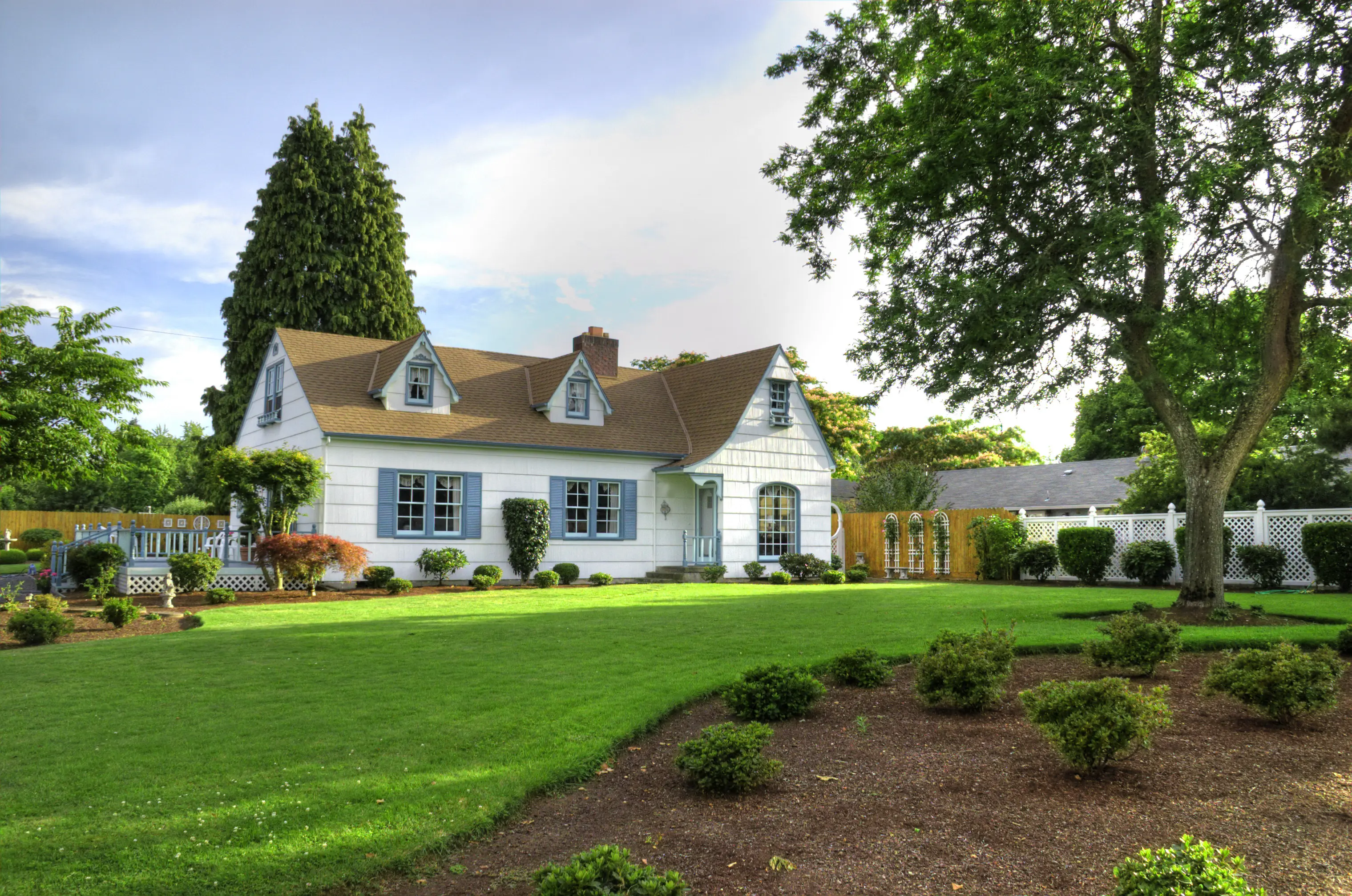 single family home with beautiful lawn