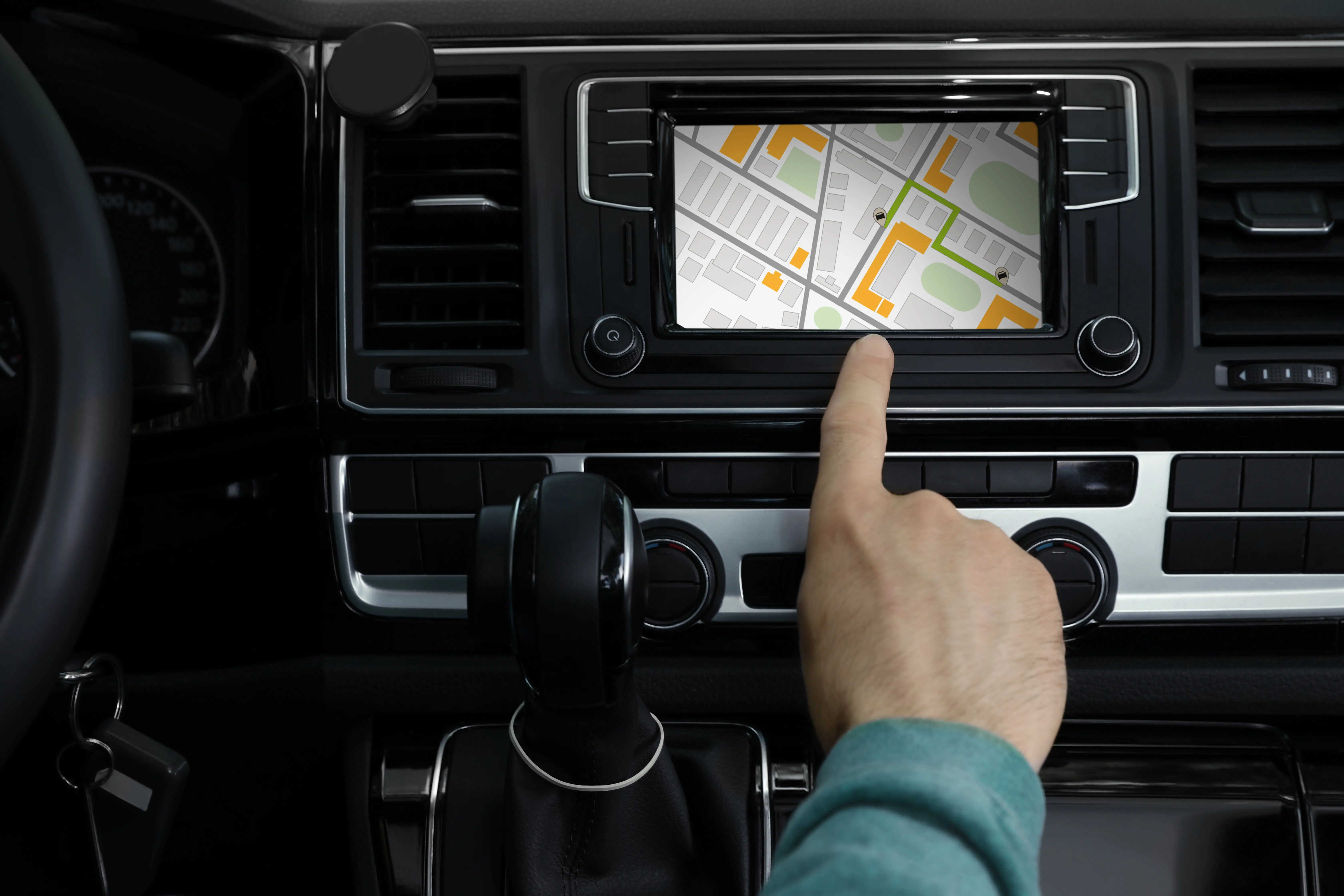 Man using navigation system while driving car, closeup