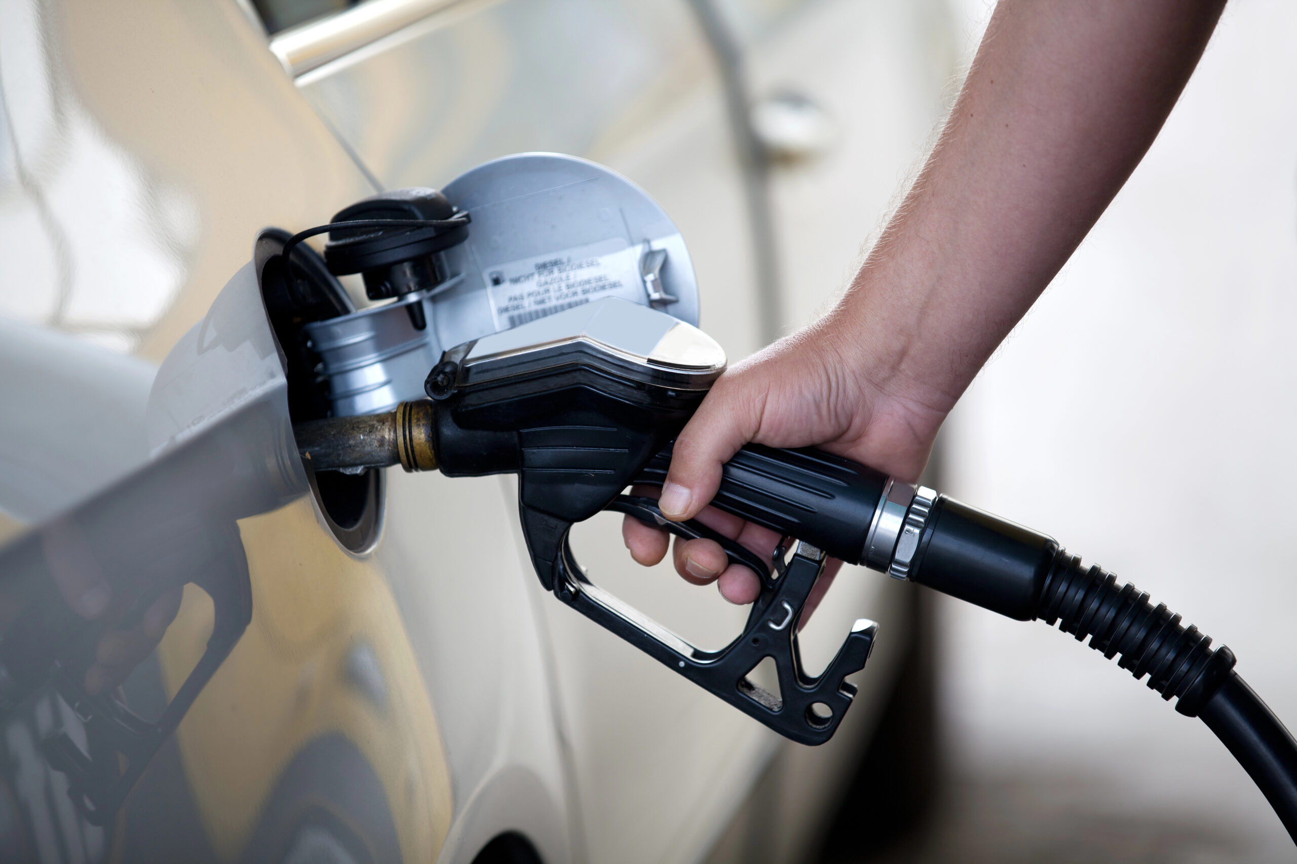 Close up of person filling gas
