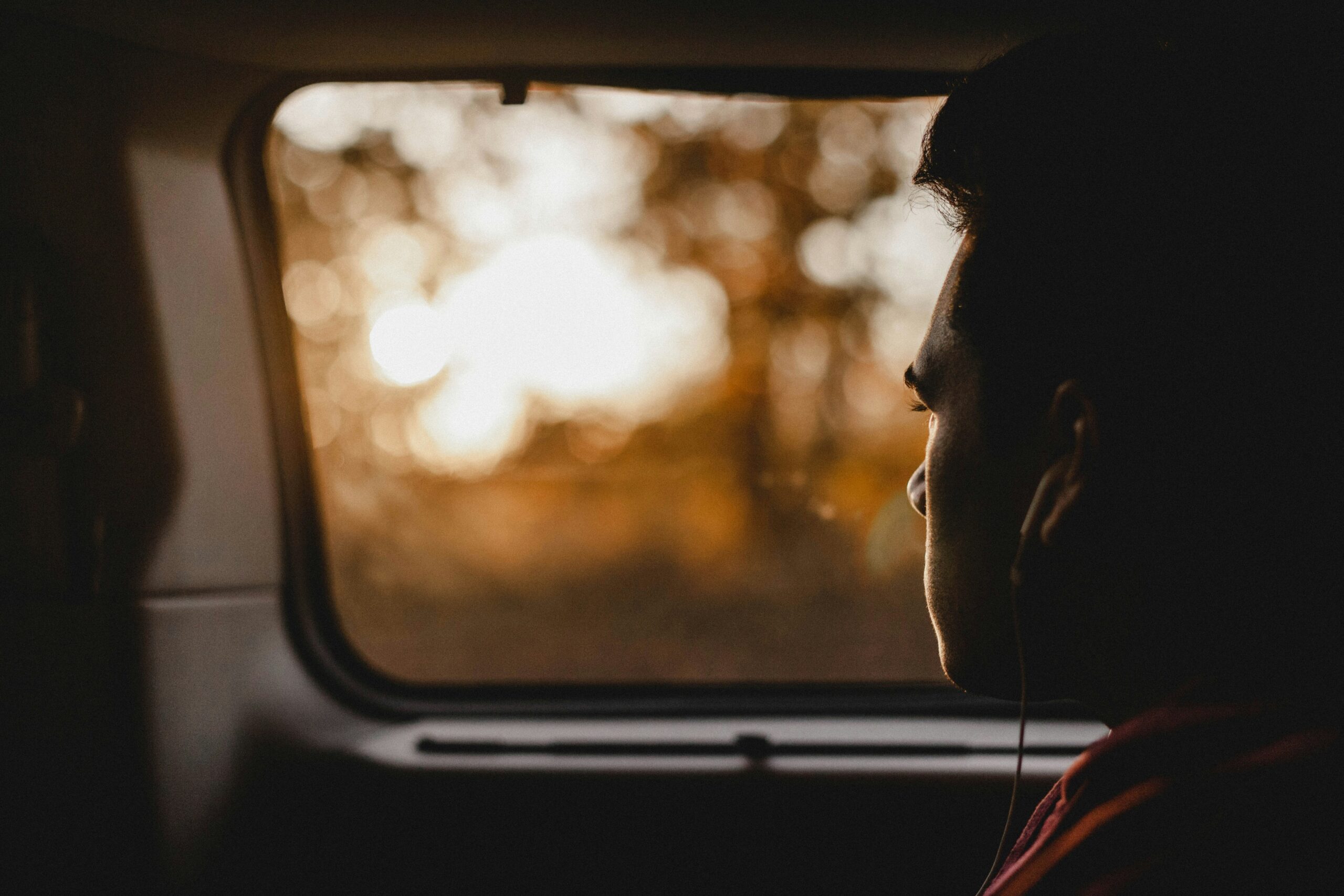 Teen looking out window scaled